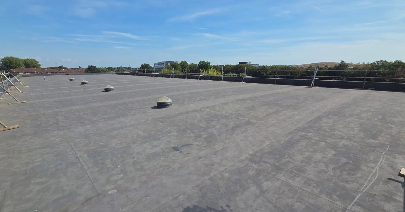 Edge protection and access scaffold installed on a flat roof in Southampton